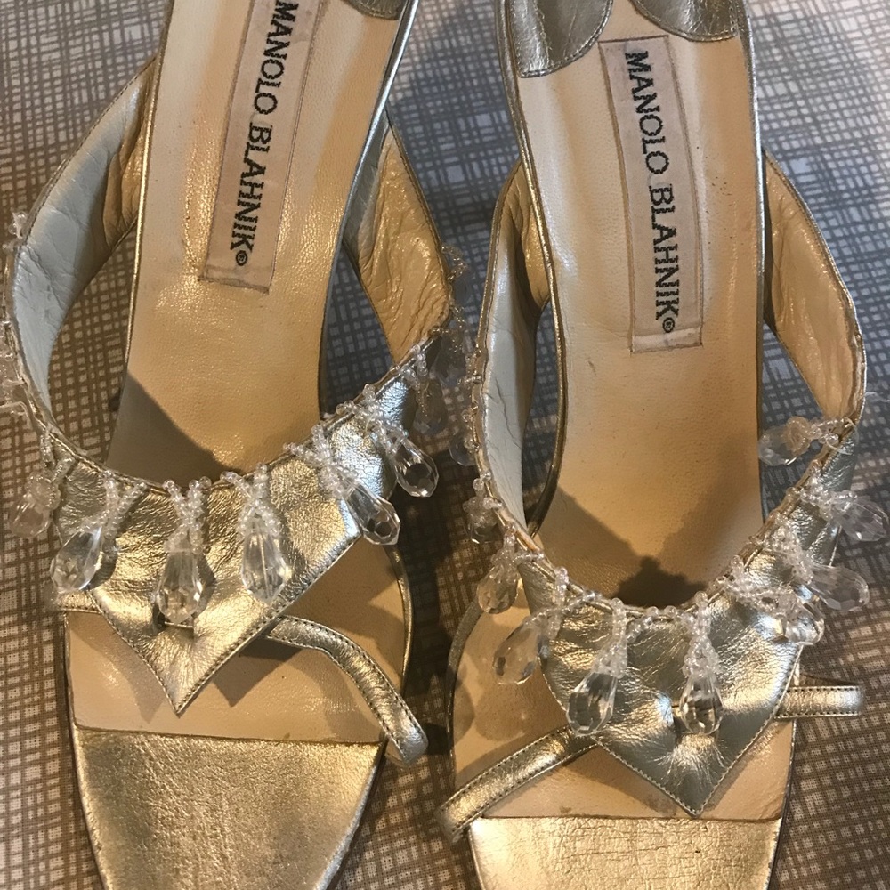 Manolo Blahnik slip on short heel.